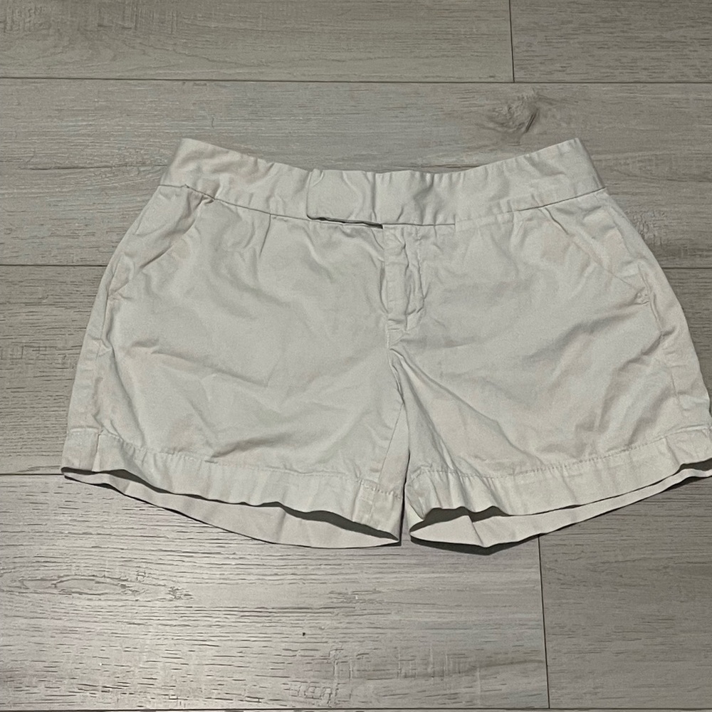 Calvin Klein, white shorts.
